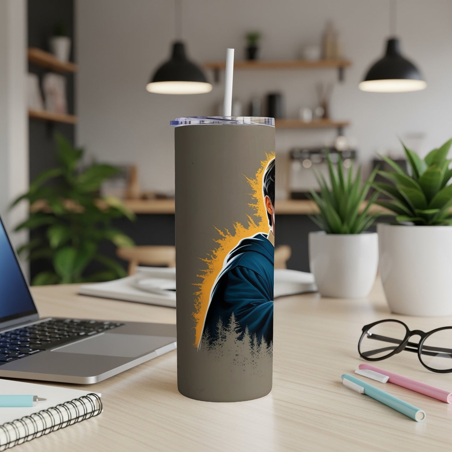 Tumbler with illustration of person in blue hoodie against pine trees.