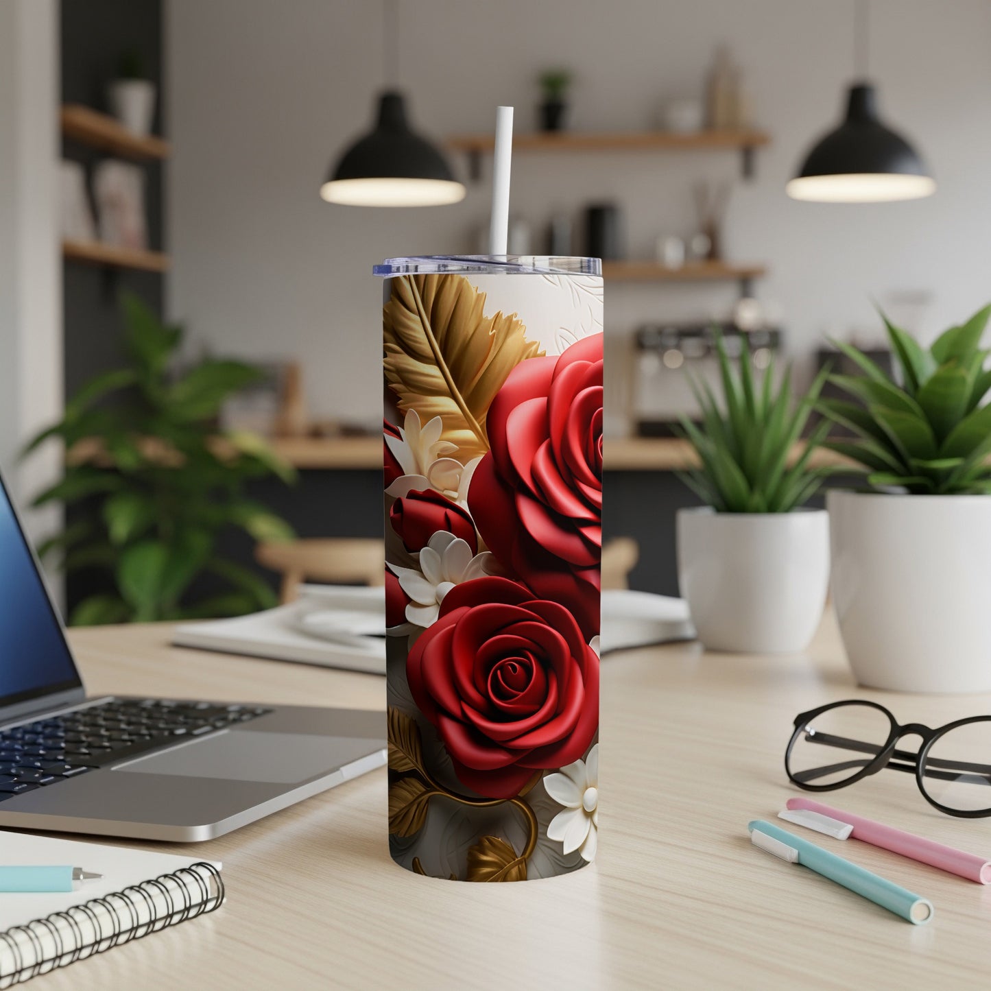 Red roses and gold leaves design on a white tumbler with a straw.