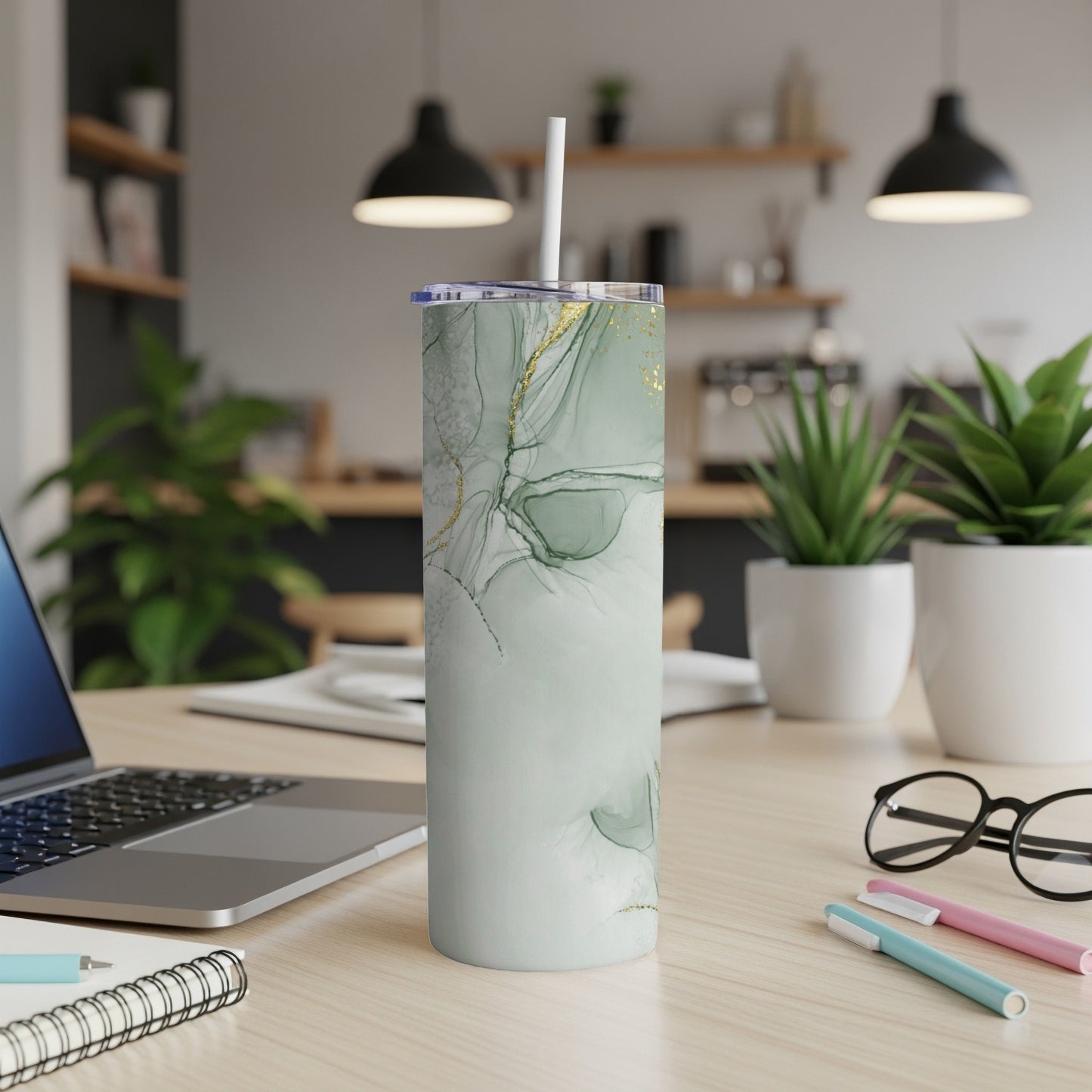 Light green marble pattern insulated tumbler with gold accents and straw.