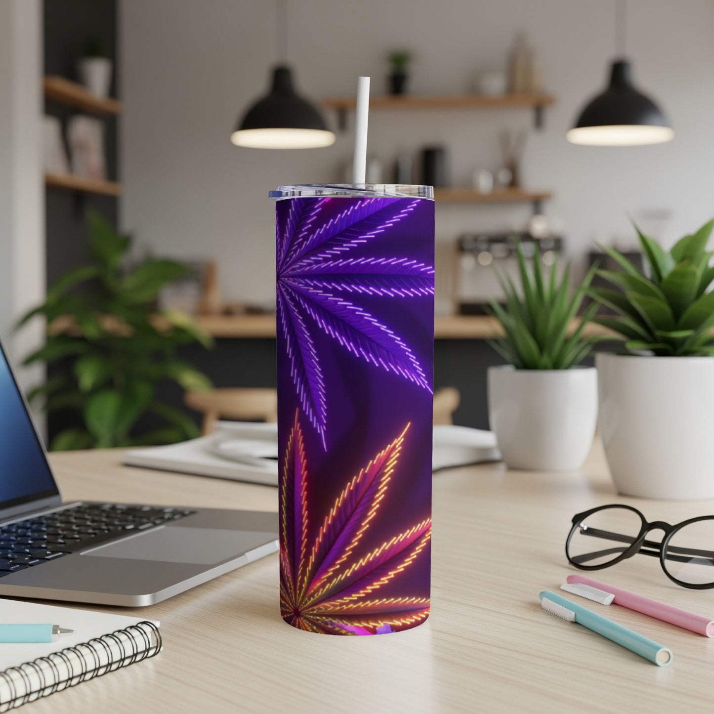 Purple and orange cannabis leaf pattern on a stainless steel tumbler with straw.
