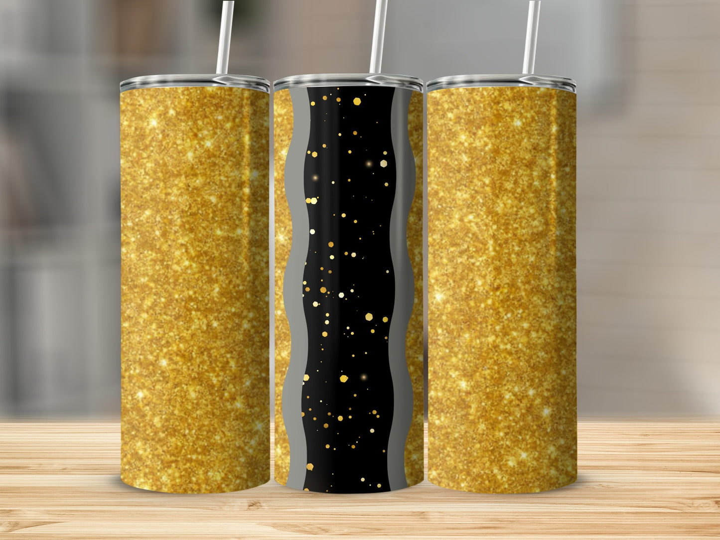 Three glitter tumblers with straws on a wooden surface.