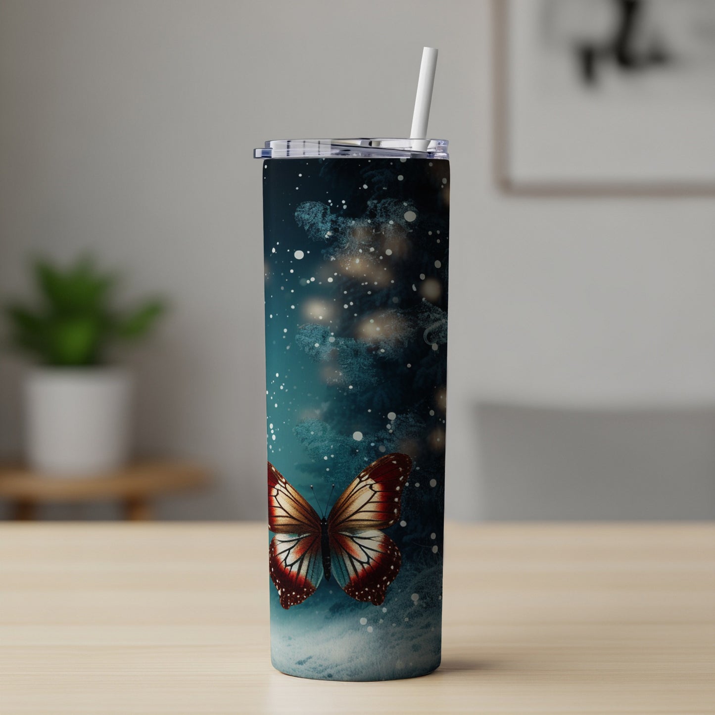Tall tumbler with a blue, starry background and a prominent butterfly graphic.