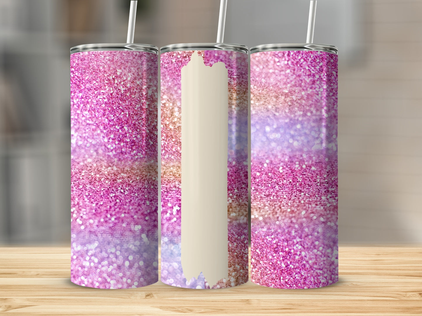 Three glitter tumblers with pink, purple, and gold hues.