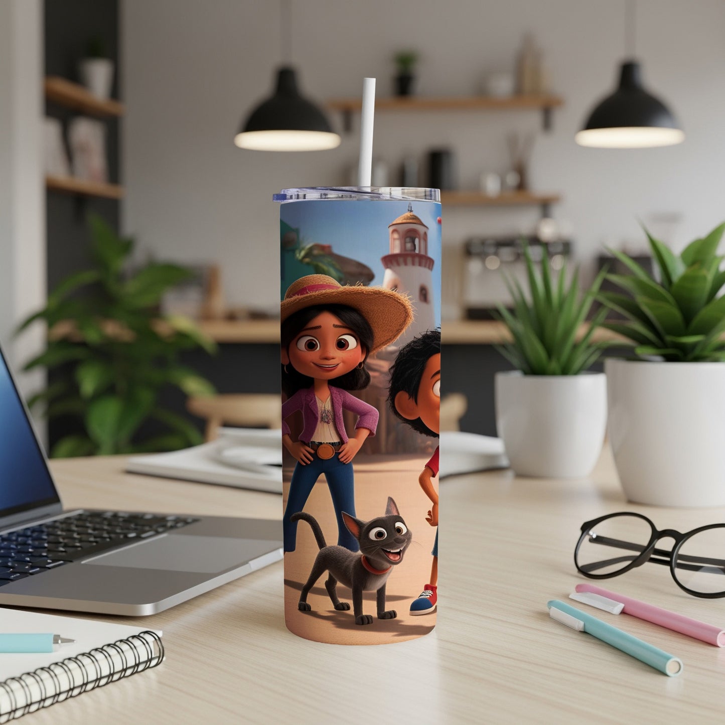 Maya and the Three characters on a tumbler in a home office setting.