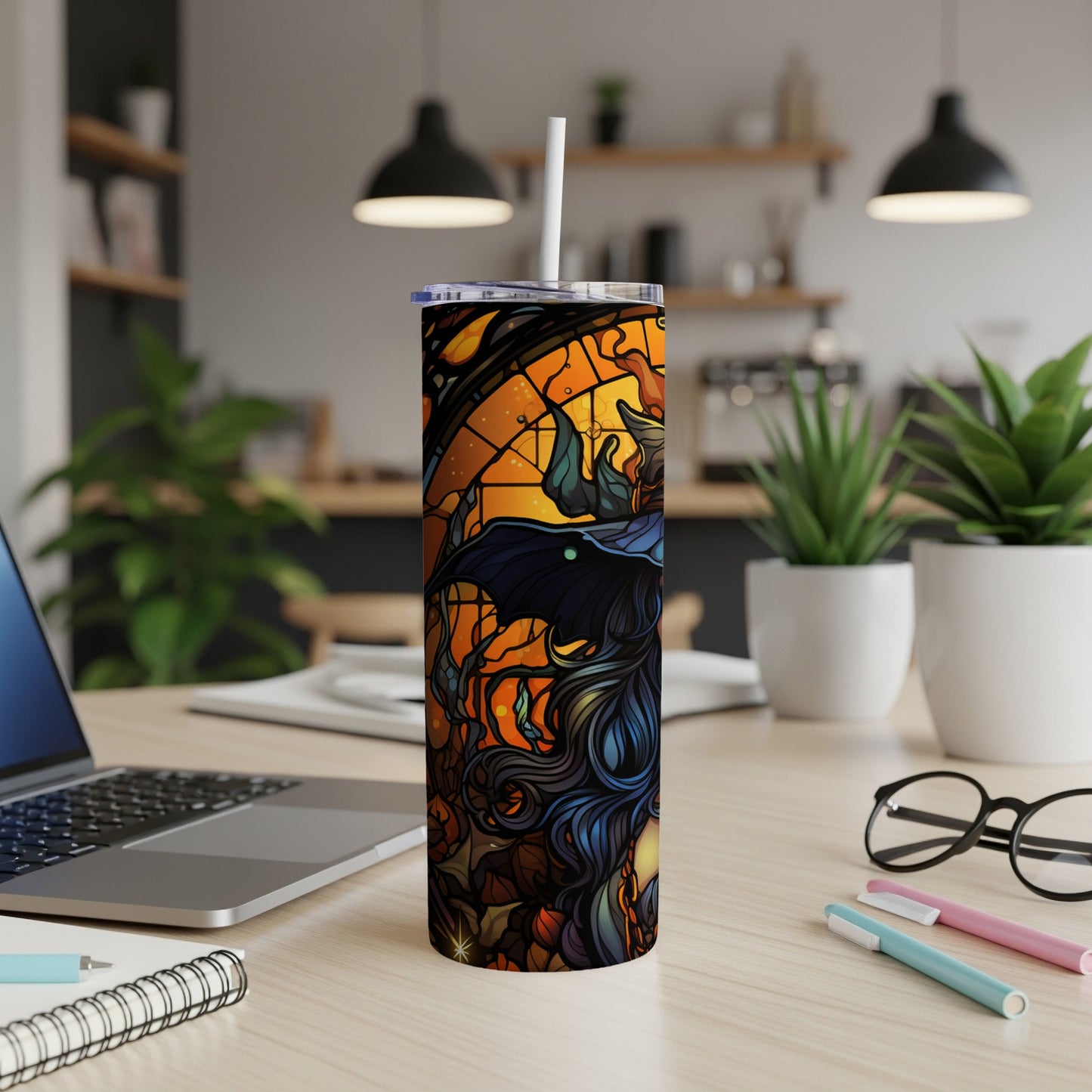 Tall tumbler with a witch and stained glass Halloween design.