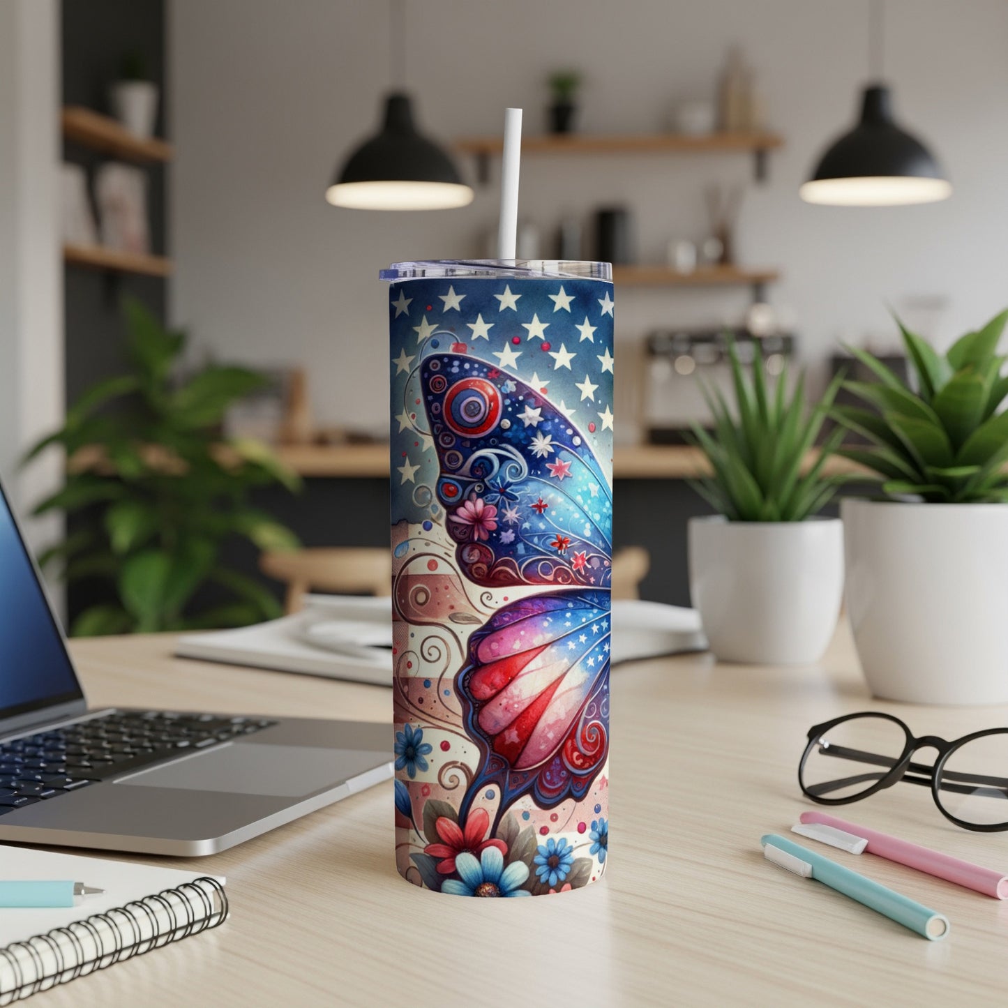 Tumbler with patriotic butterfly design and stars.