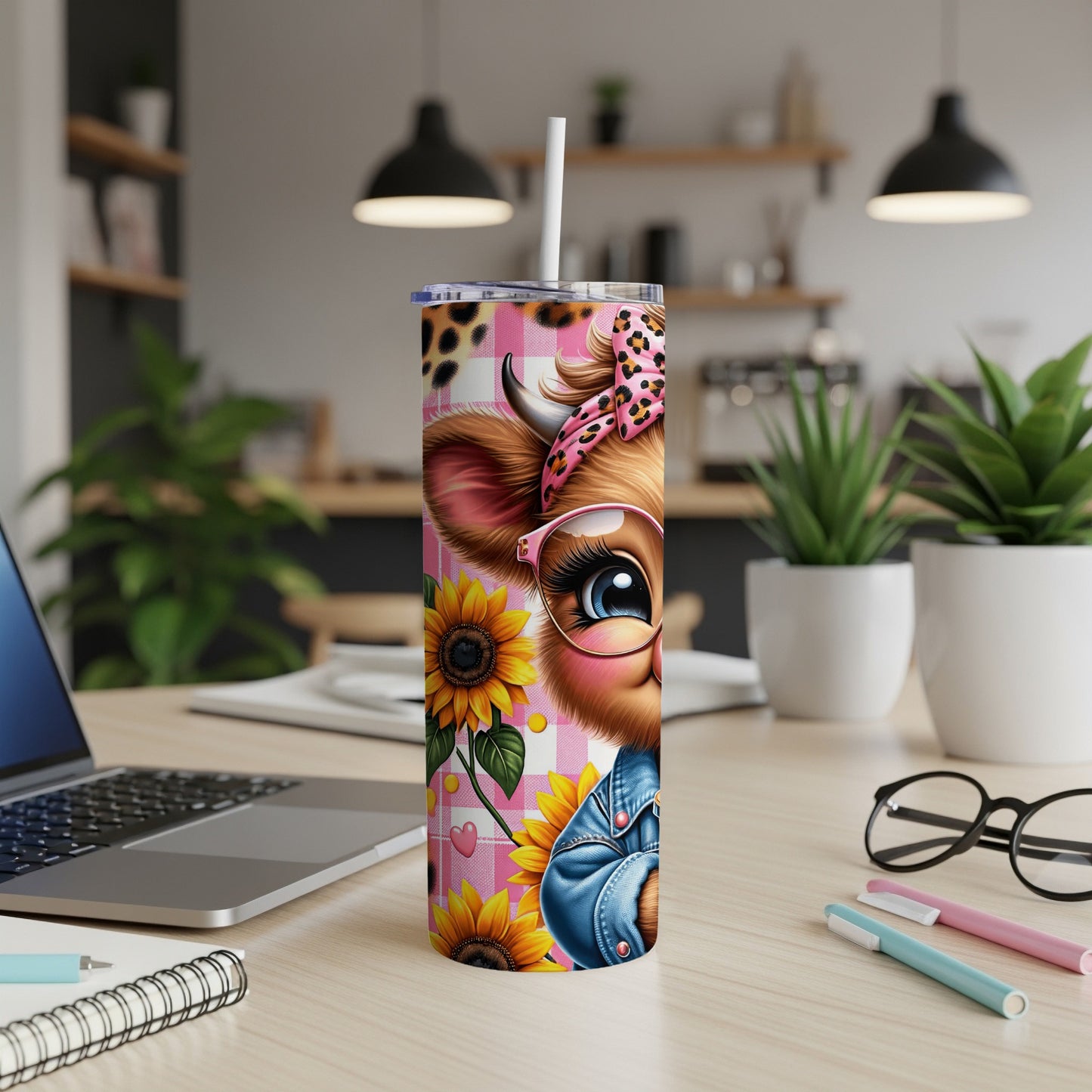 Pink leopard print tumbler with cartoon cow and sunflowers.