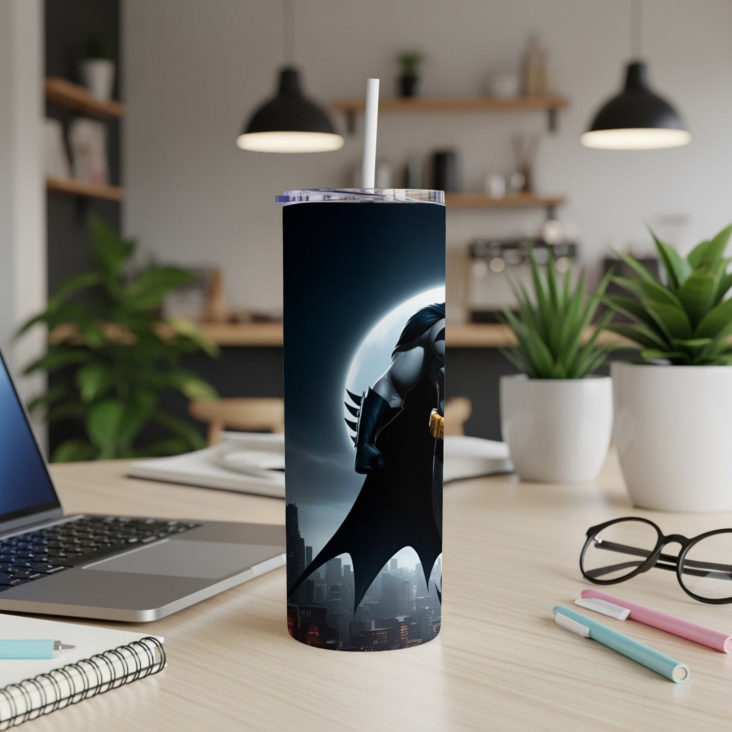 Batman tumbler with city skyline and moon backdrop.