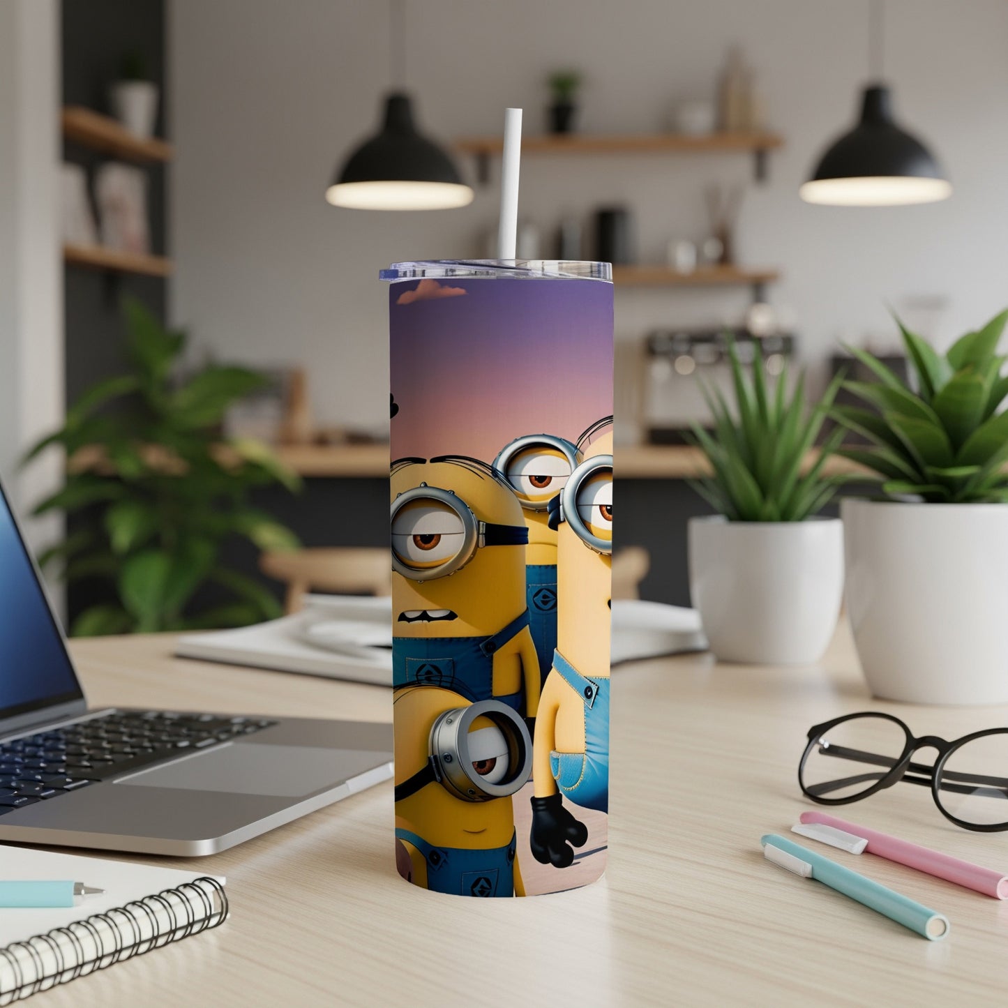 Minions Stuart and Kevin on a tumbler with a straw, on a desk.