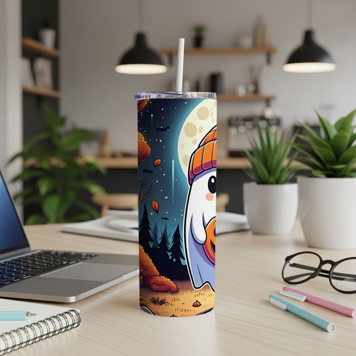 Tumbler with a cartoon ghost, pumpkin, and fall scenery under a large moon.