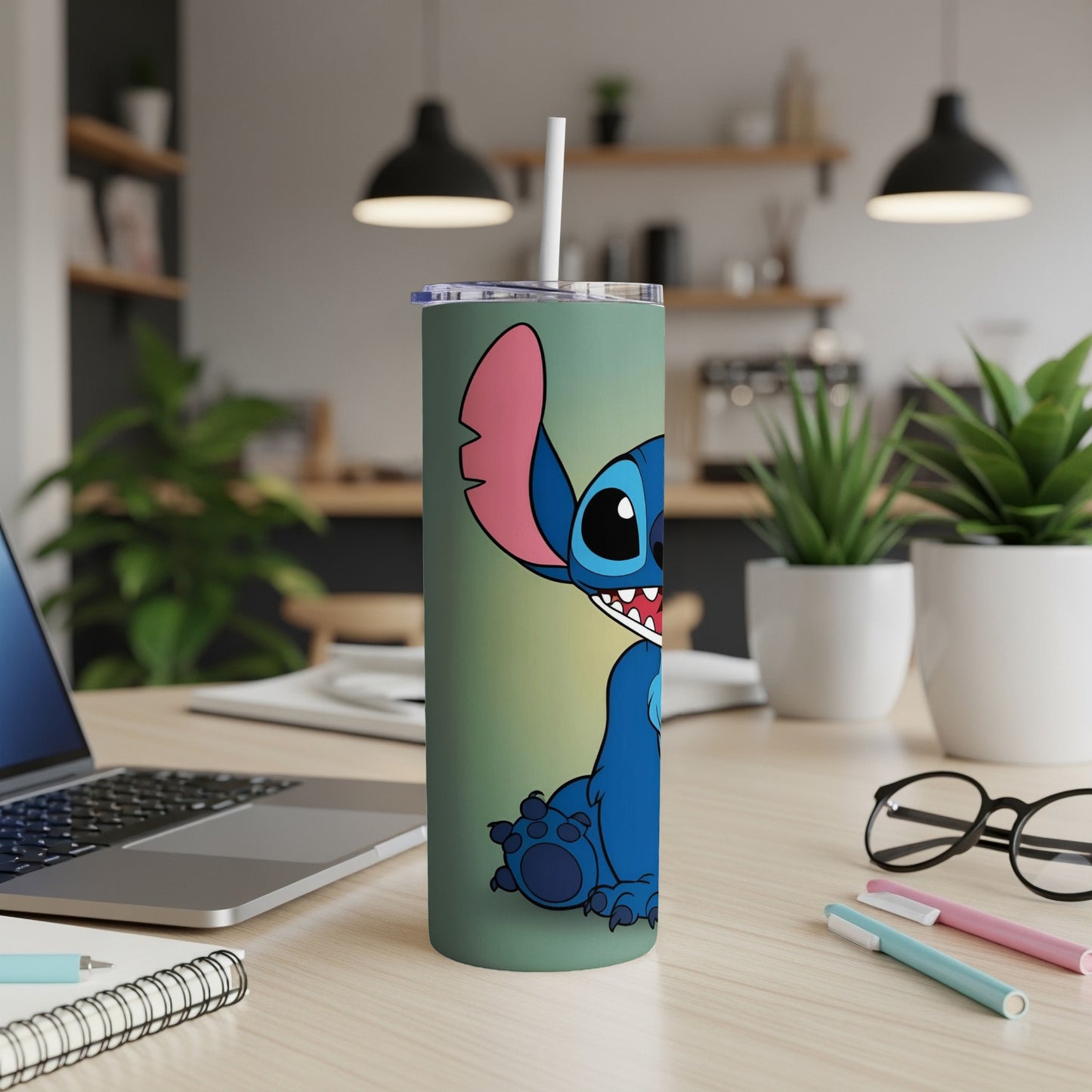 Blue alien Stitch character on a green tumbler with a straw.