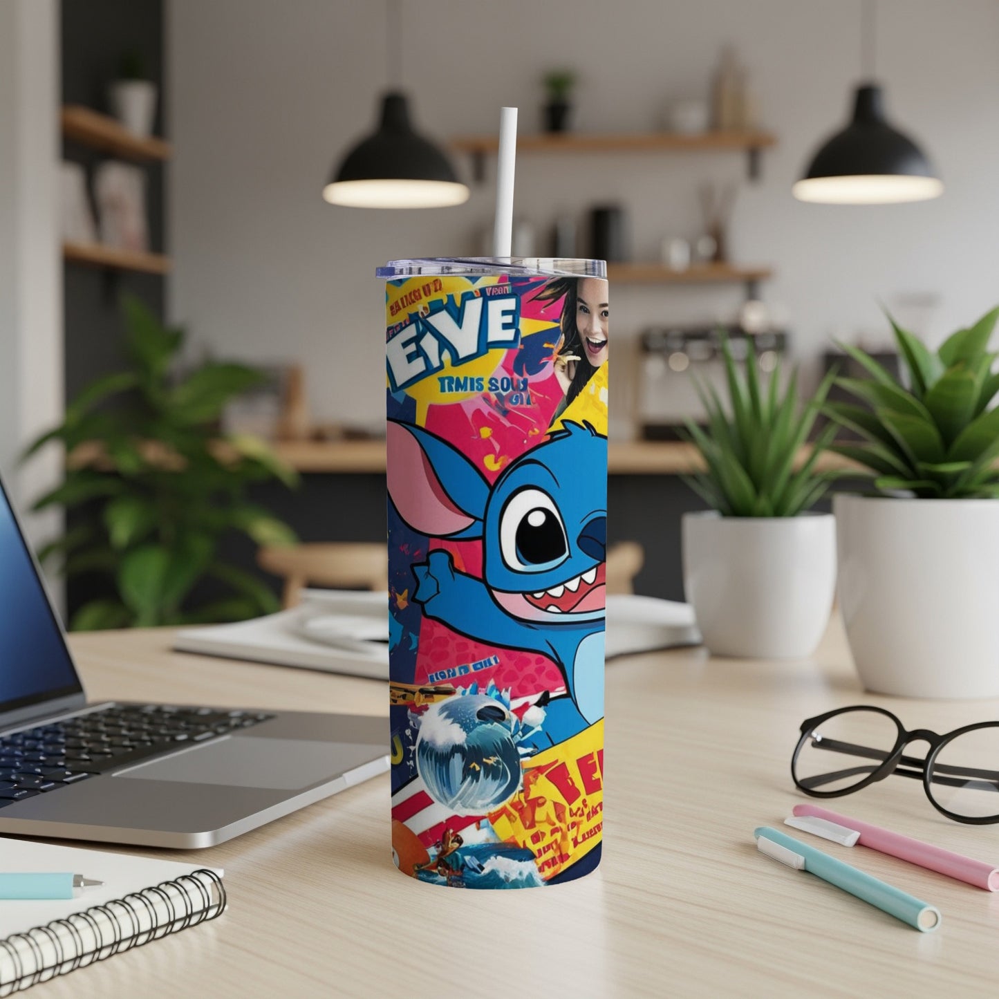 Stitch character on a skinny tumbler with a straw on a desk.