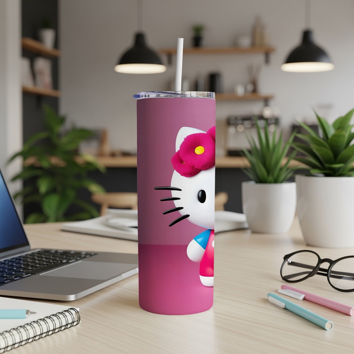 Pink tumbler with Hello Kitty and a red flower bow.