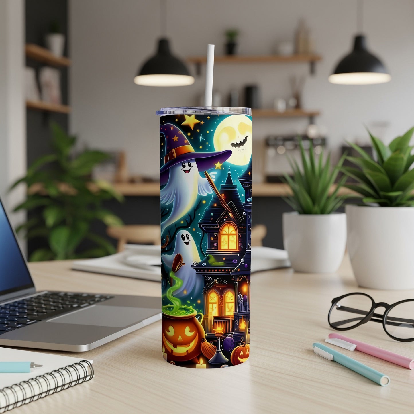 Halloween tumbler with ghosts, haunted house, pumpkin, and full moon design.