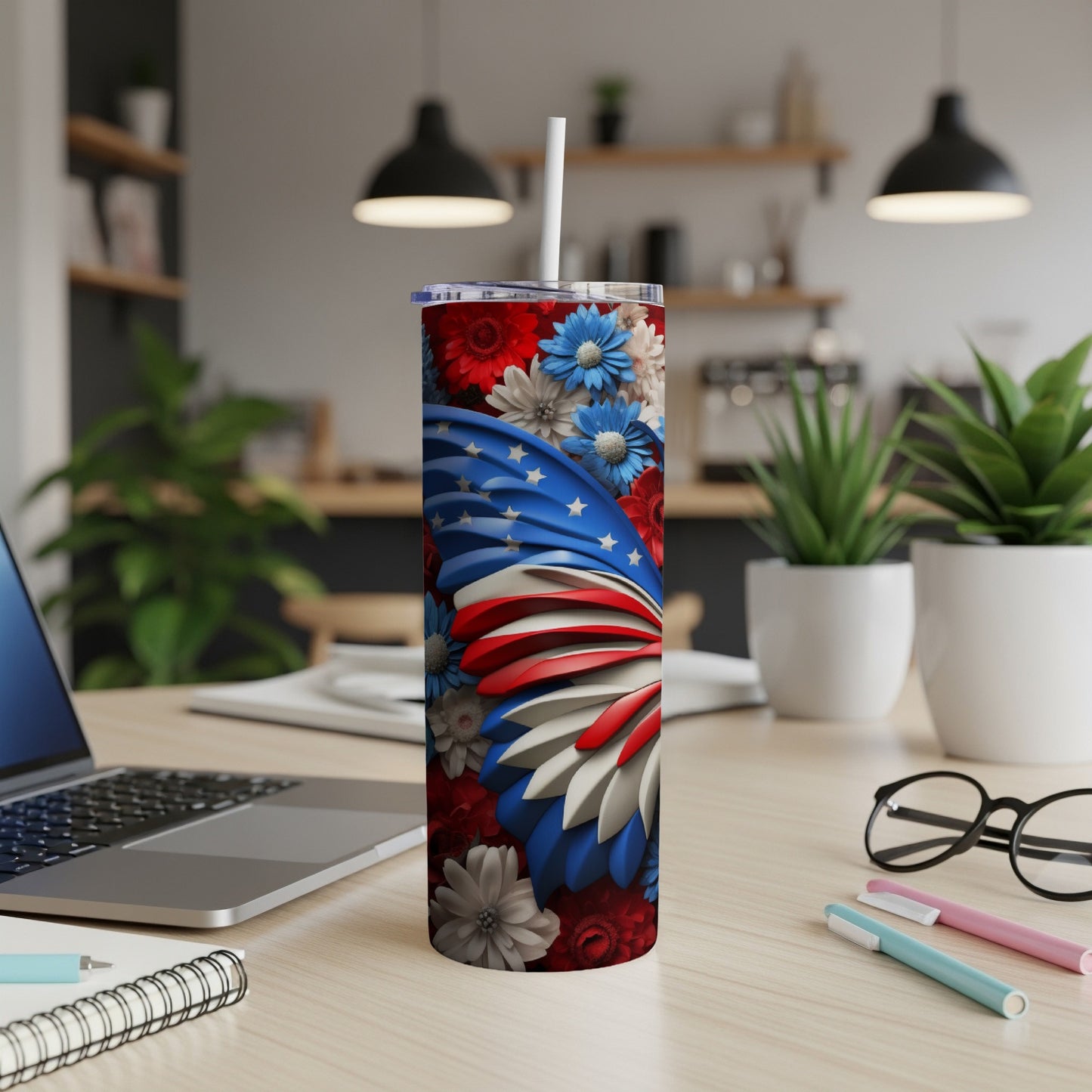 Red, white, and blue floral tumbler with a patriotic star-spangled wing design.