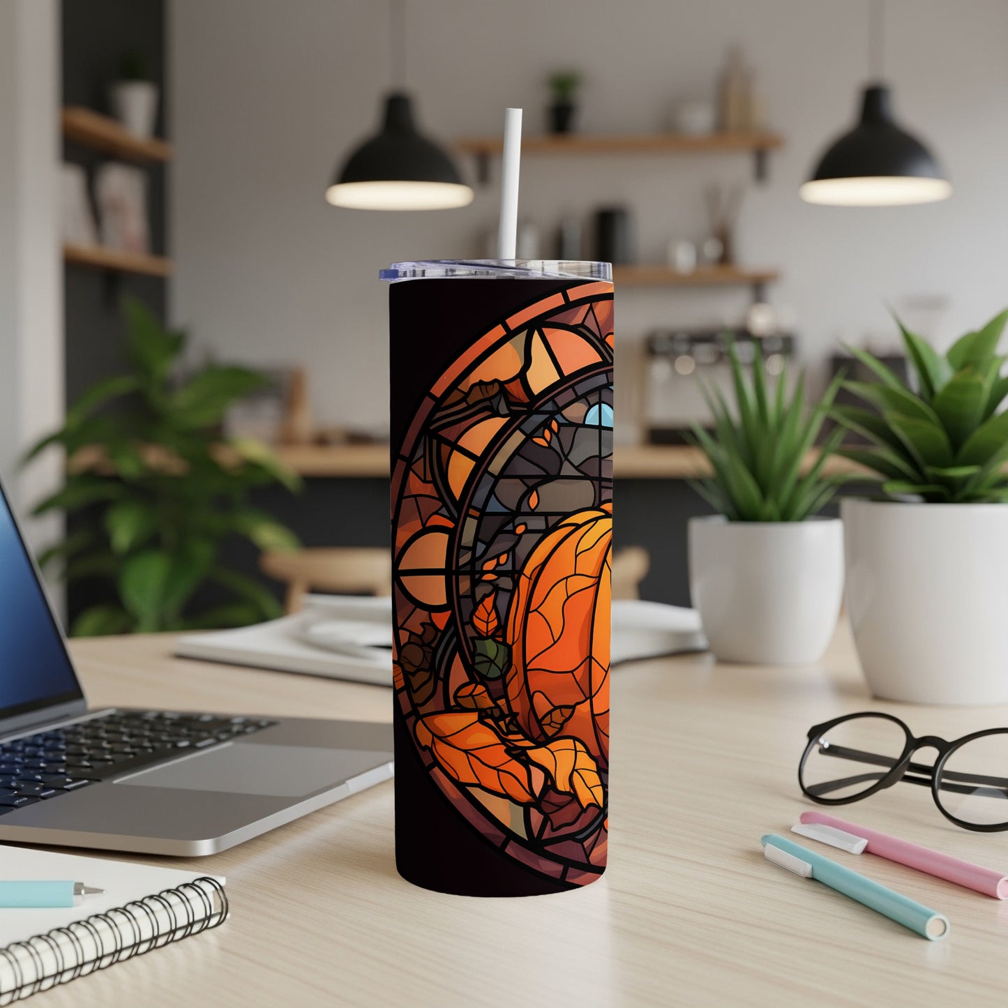 Tumbler with stained glass pumpkin and autumn leaves design.