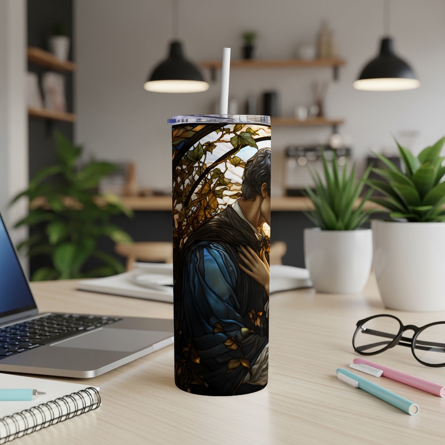 Tattooed figure on a stained glass tumbler with a straw.