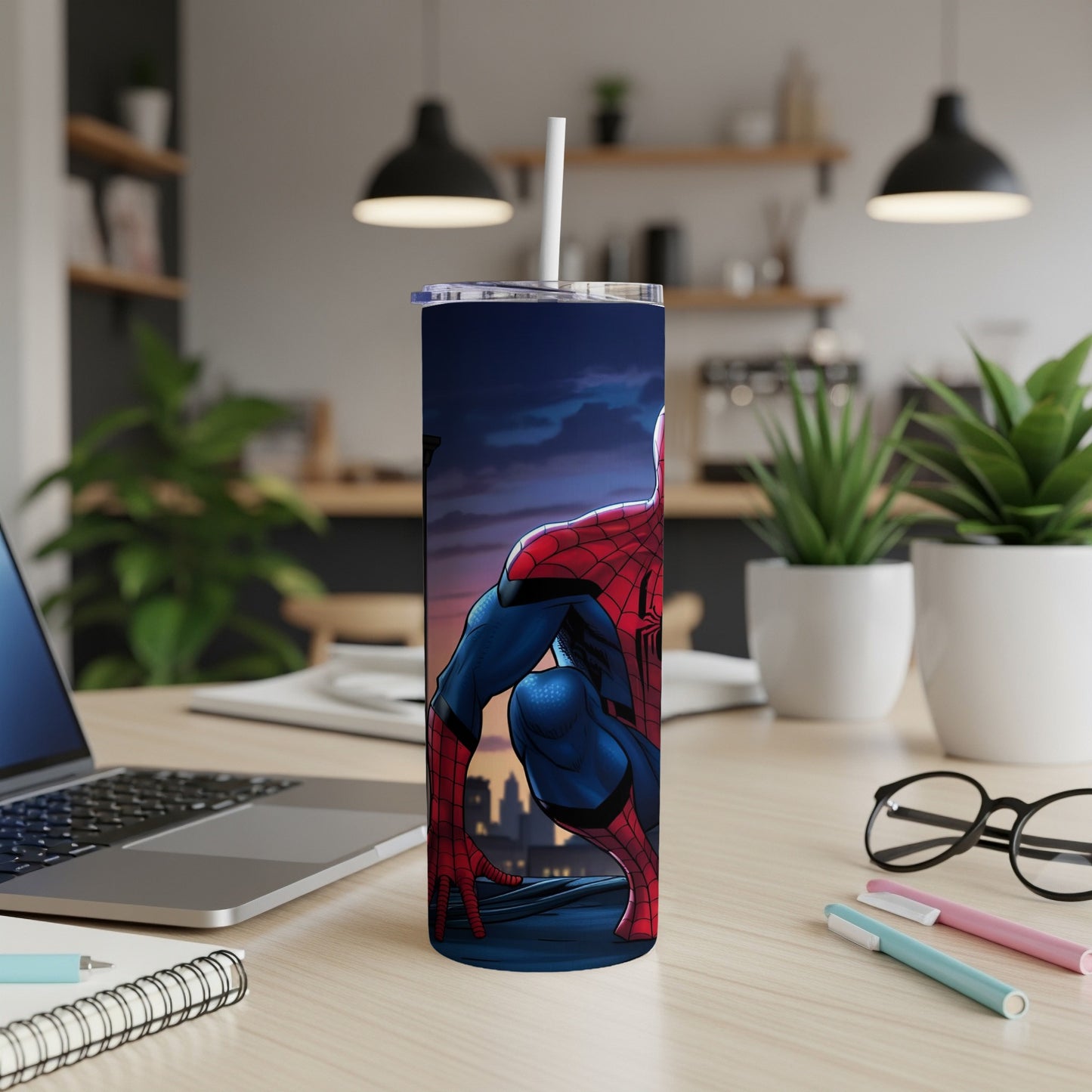 Spider-Man superhero character on a dark blue tumbler with a white straw.