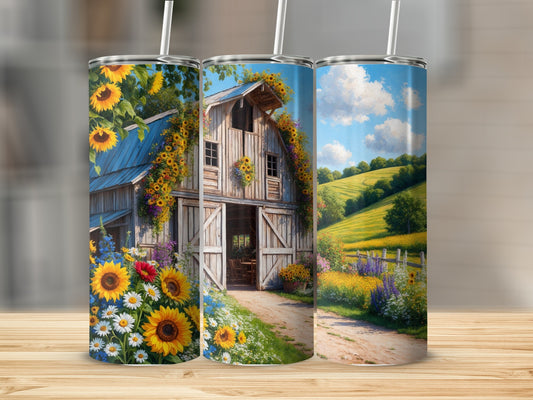 Rustic barn with sunflowers and daisies on a tumbler.