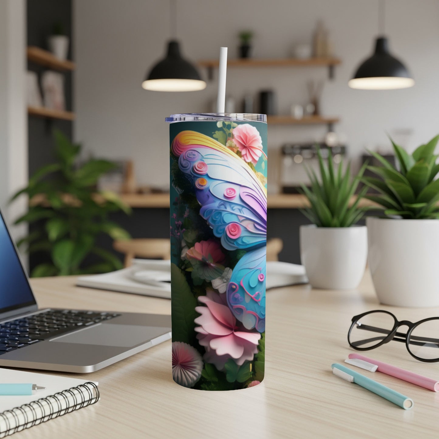 Butterfly design on a white tumbler with a straw.