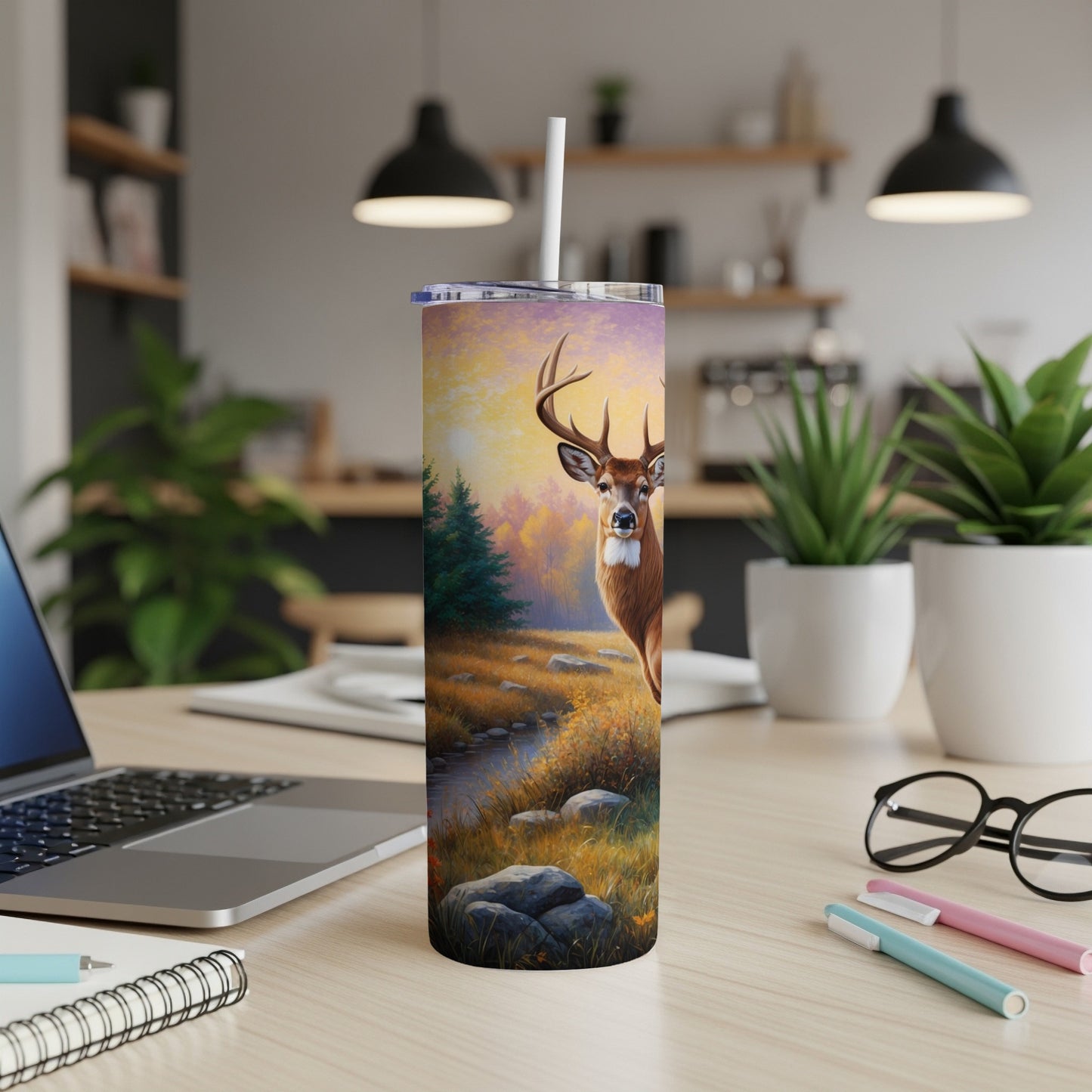 Deer in a forest landscape on a tumbler with a straw.