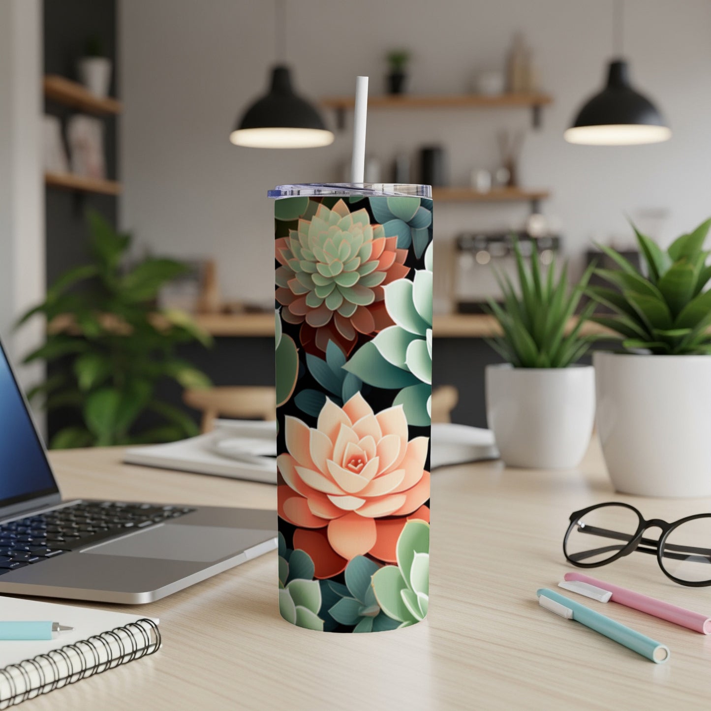 Succulent pattern on a white stainless steel tumbler with a straw.