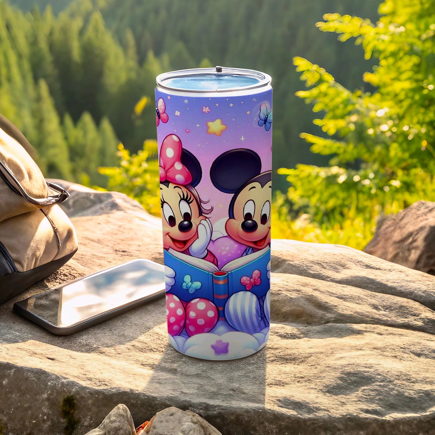 Mickey and Minnie Mouse reading a book on a colorful tumbler.