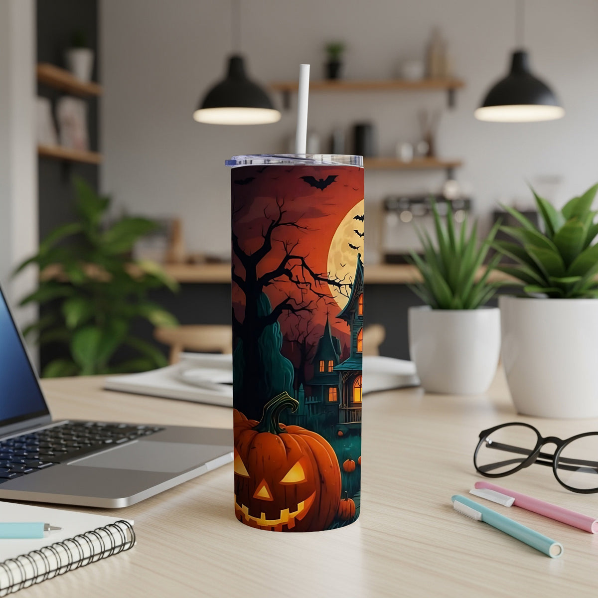 Tumbler with Halloween scene featuring jack-o'-lantern, haunted house, bats, and full moon.