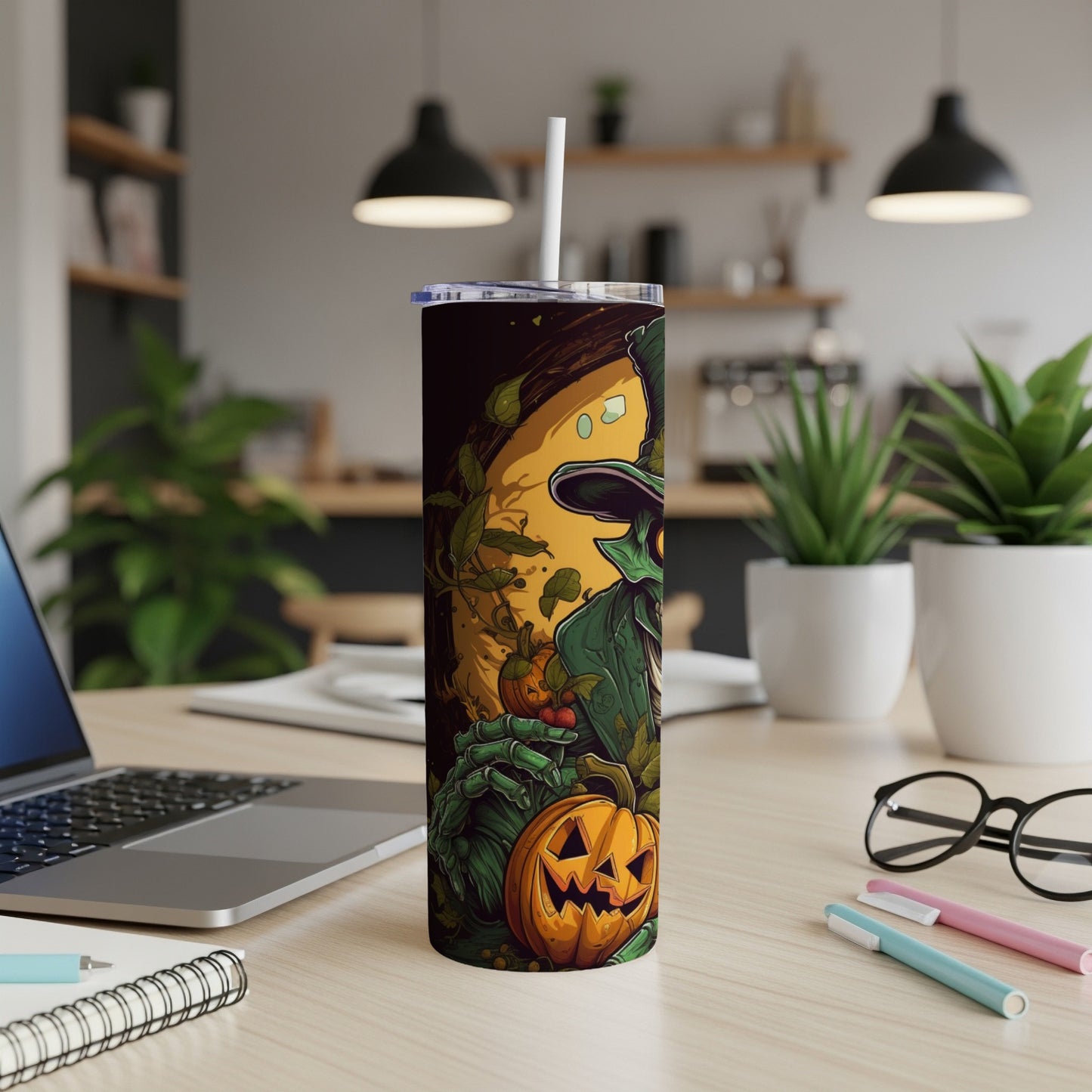 Tumbler with green witch, pumpkin, and vine illustration.