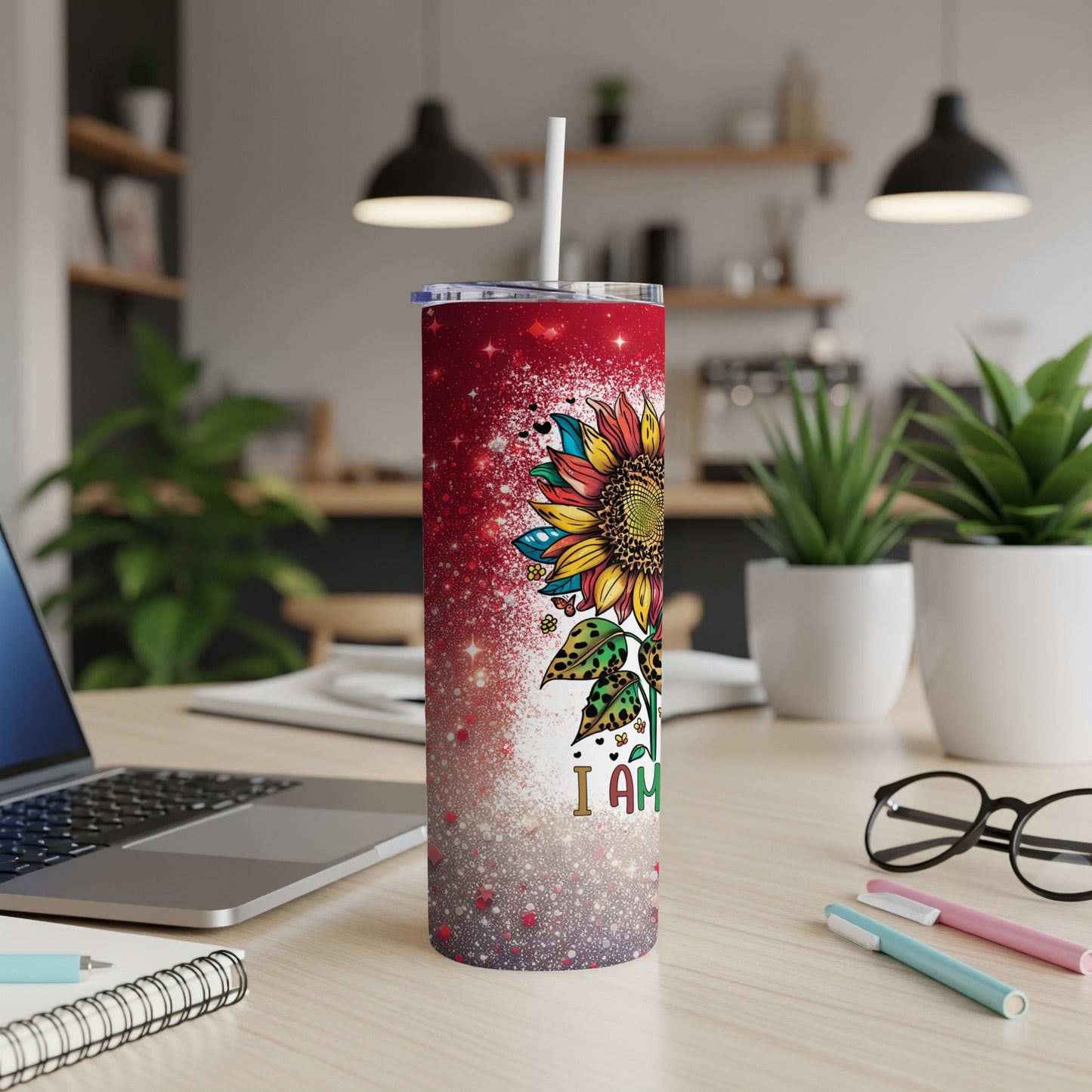 Red and white speckled tumbler with sunflower design and "I Am" text.