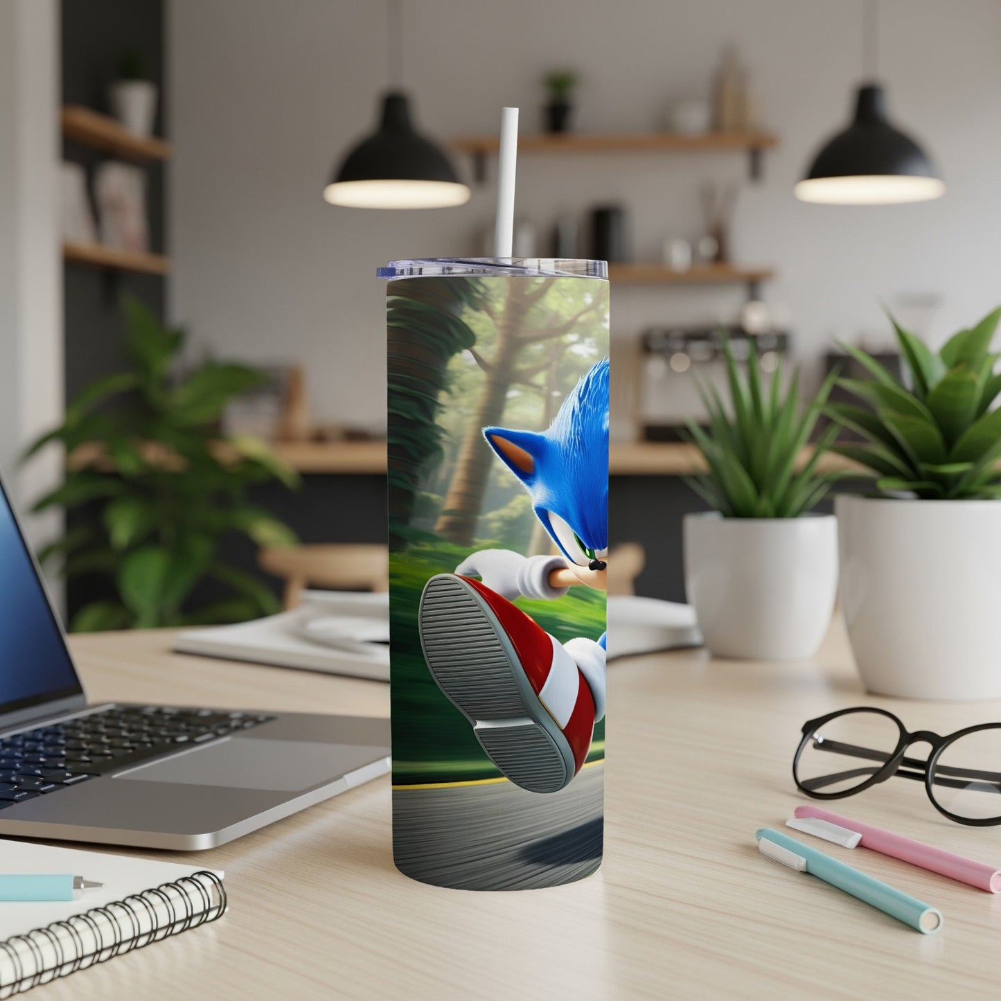 Sonic the Hedgehog running with a straw in a tumbler on a desk.