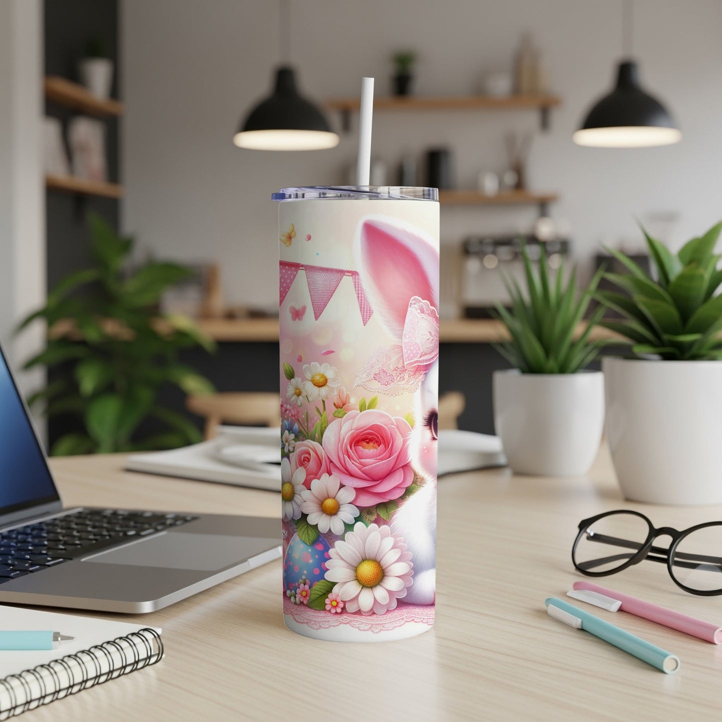White bunny with pink ears on a floral Easter tumbler with a straw.