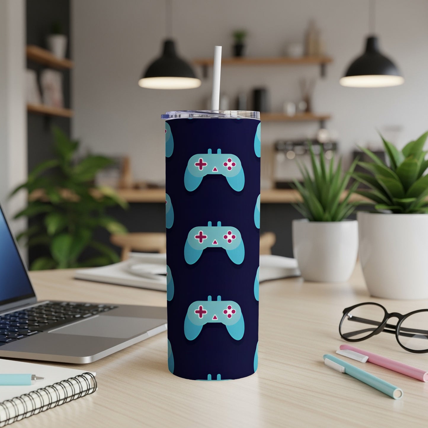 Dark blue tumbler with repeating pattern of light blue video game controllers.