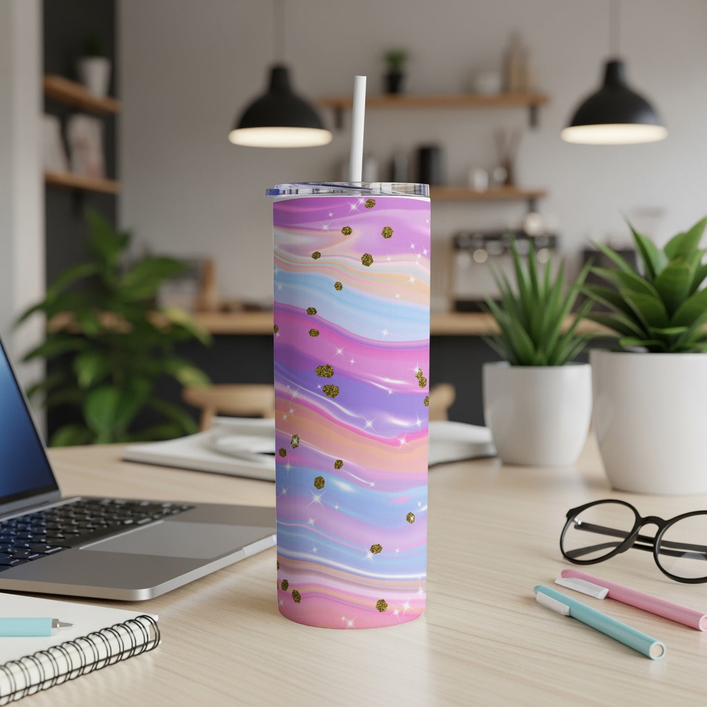 Tumbler with pastel swirl design and gold glitter accents.
