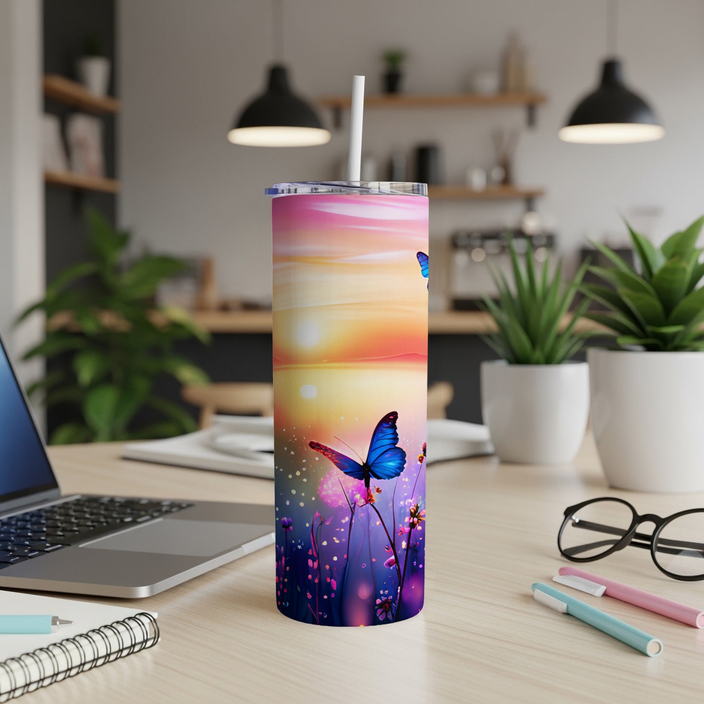 Pink and purple sunset with butterflies on a white tumbler with straw.