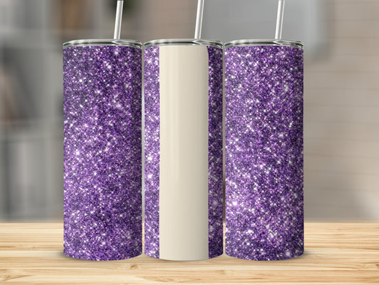 Three glitter-covered tumblers with cream-colored sections and straws on a wooden surface.