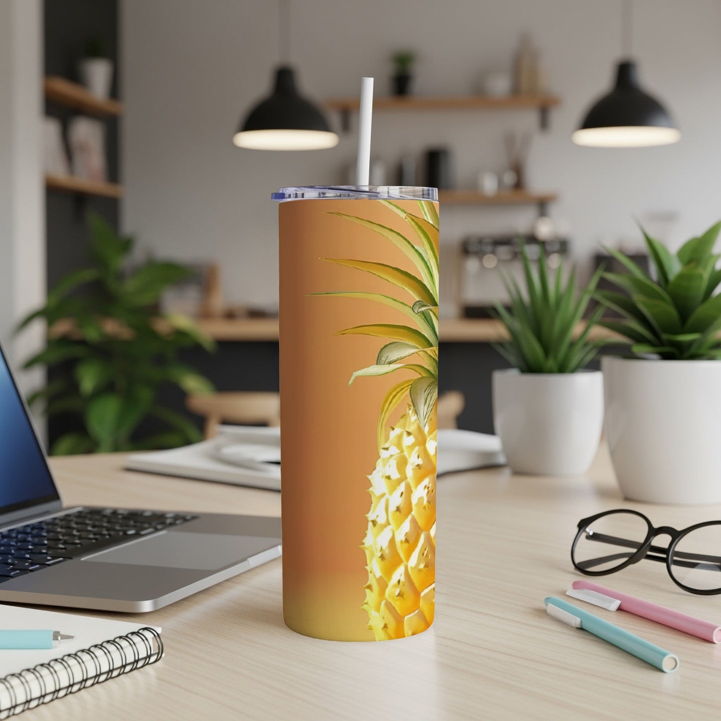 Tall tumbler with a detailed pineapple graphic on an orange gradient background.