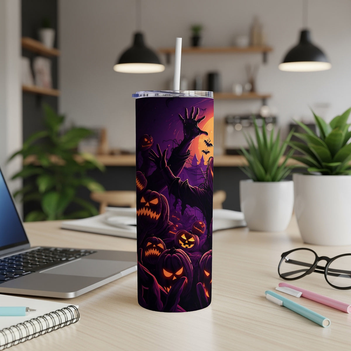 Halloween tumbler with jack-o'-lanterns and a spooky creature illustration.