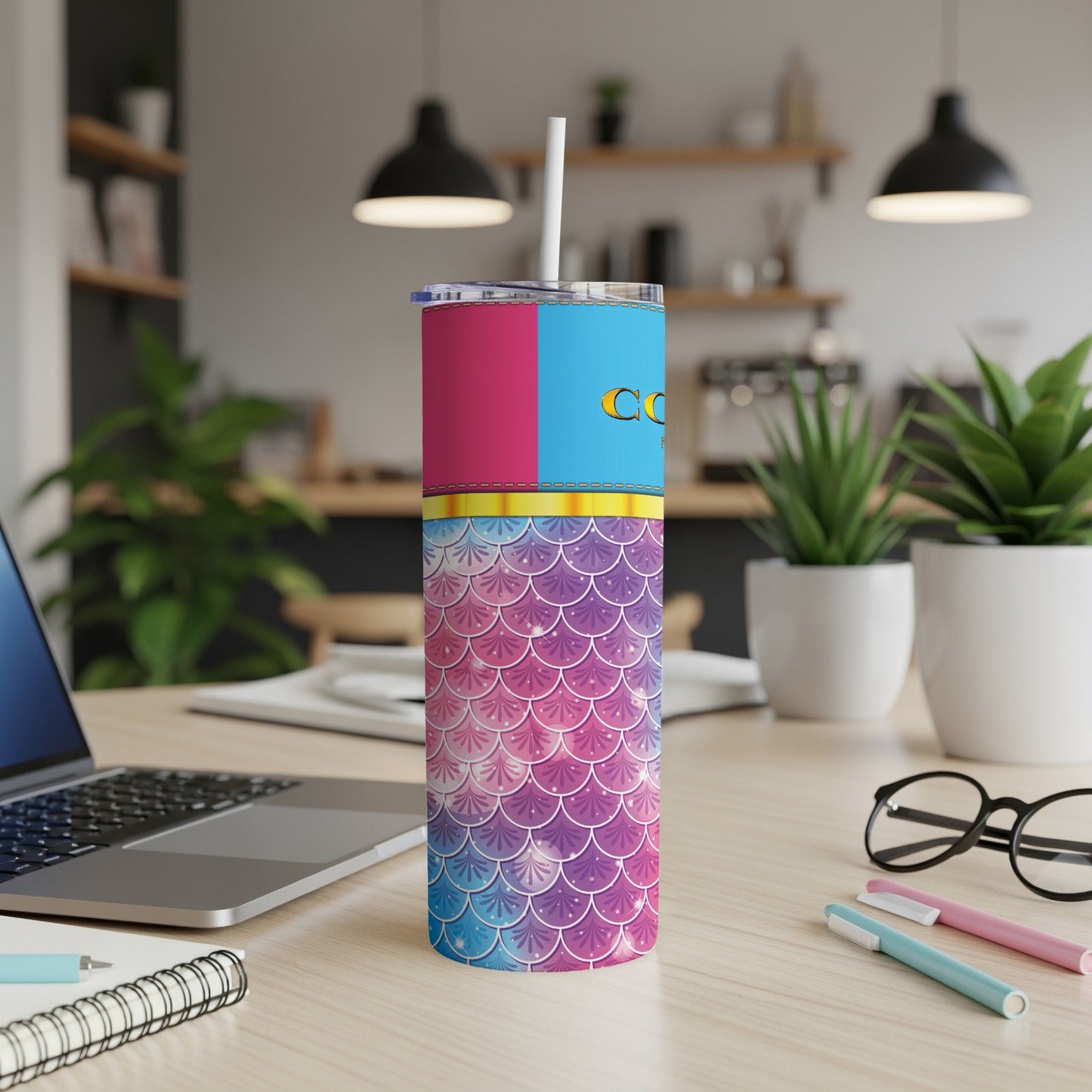 Skinny tumbler with pink, blue, and mermaid scale design.