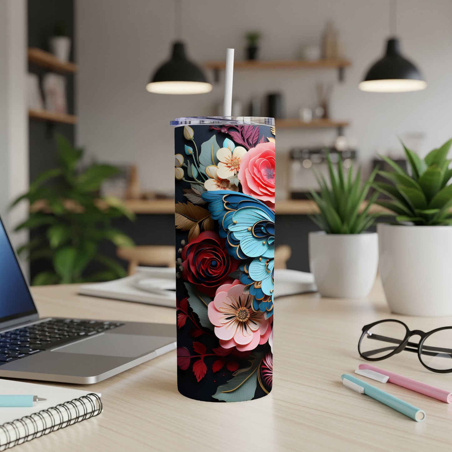 Tall tumbler with a dark background and colorful floral and butterfly pattern.