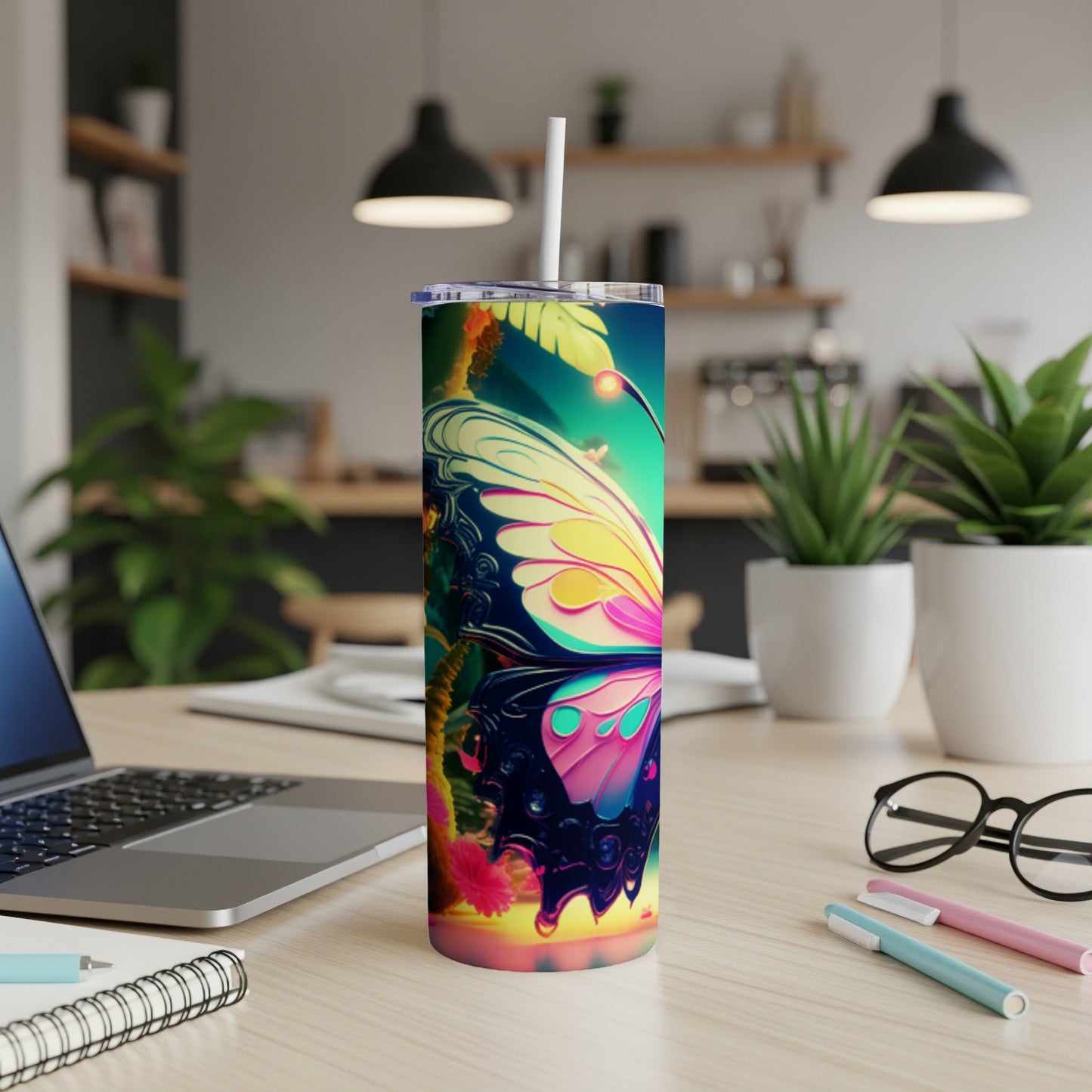 Colorful butterfly design on a white skinny tumbler with straw.