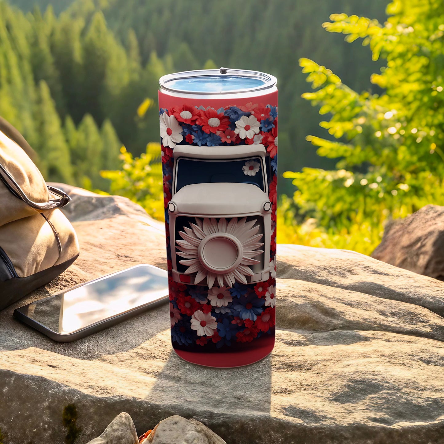 Red tumbler with white truck and floral design, phone, and backpack.