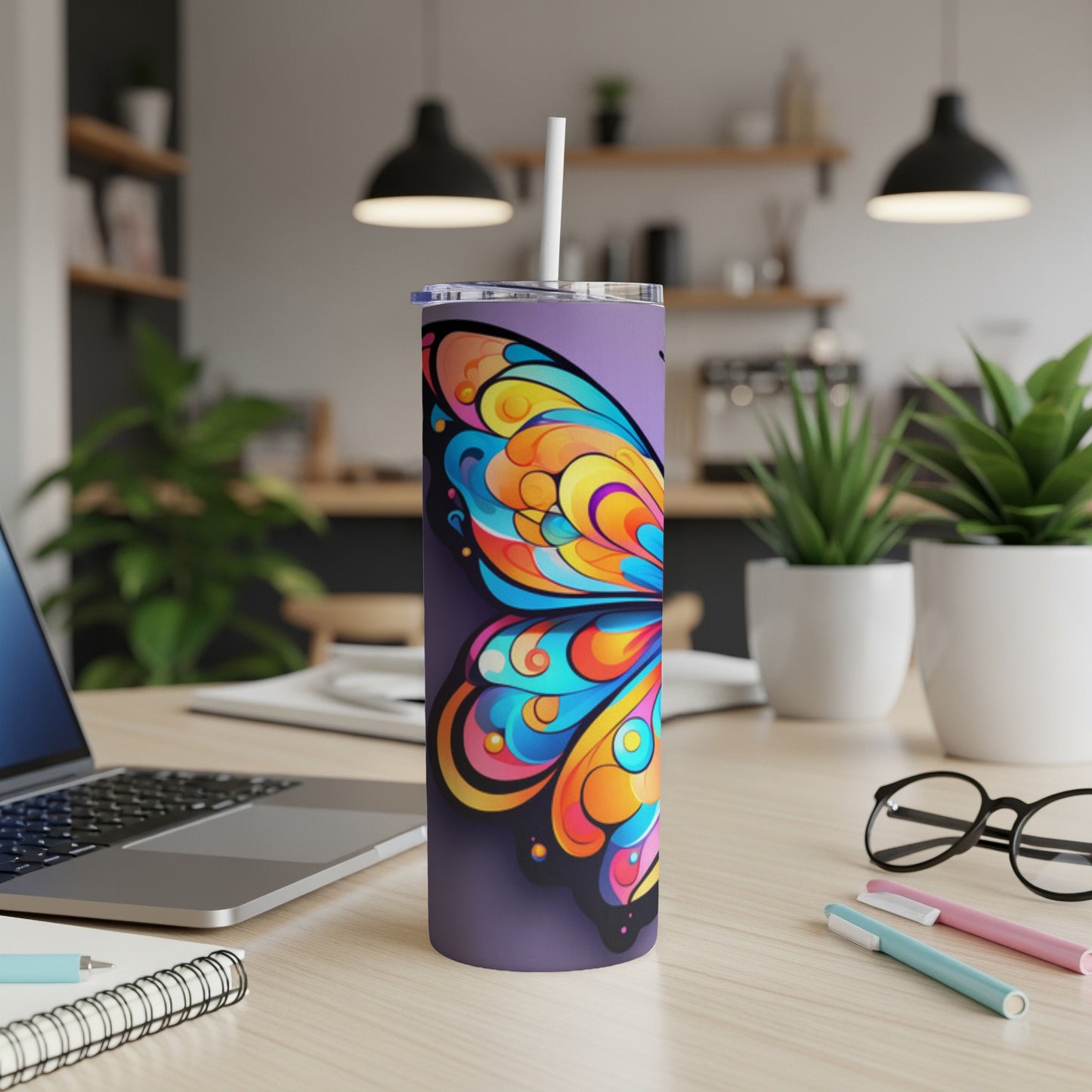 Purple tumbler with a colorful butterfly wing design.