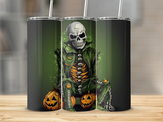 Skeleton in green jacket and pants sitting on pumpkins, with straw in tumblers.