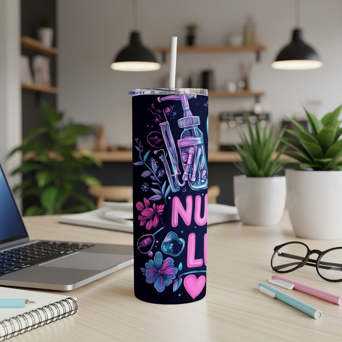 Tumbler with "NURSE" text and medical icons on dark floral background.