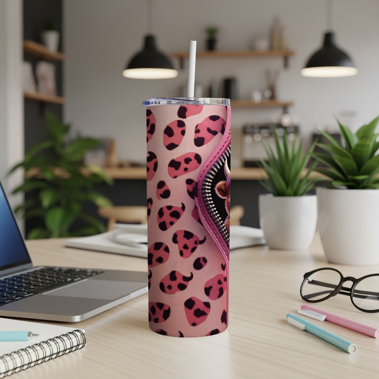 Pink tumbler with black and pink leopard print and a silver zipper detail.