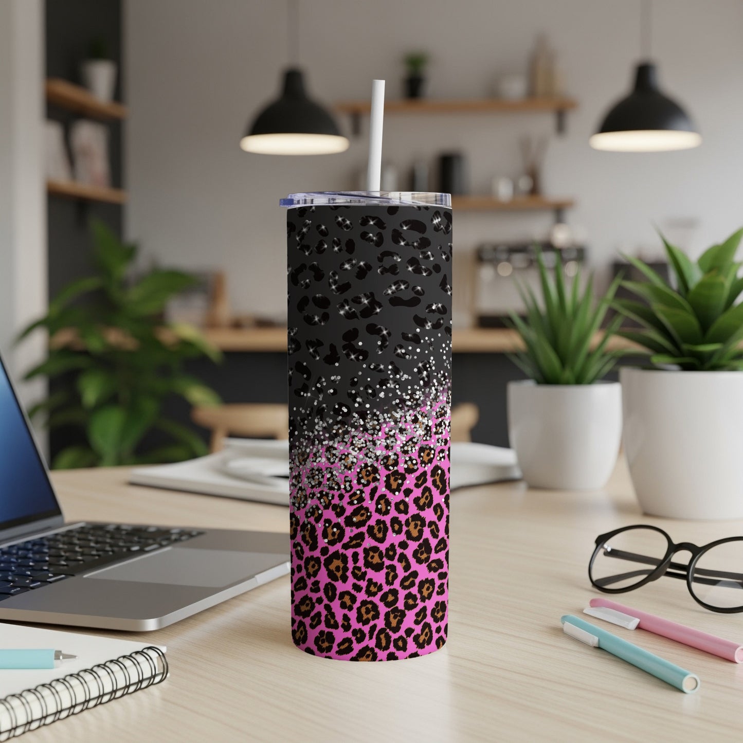 Black tumbler with pink leopard print and glitter accents, with straw.