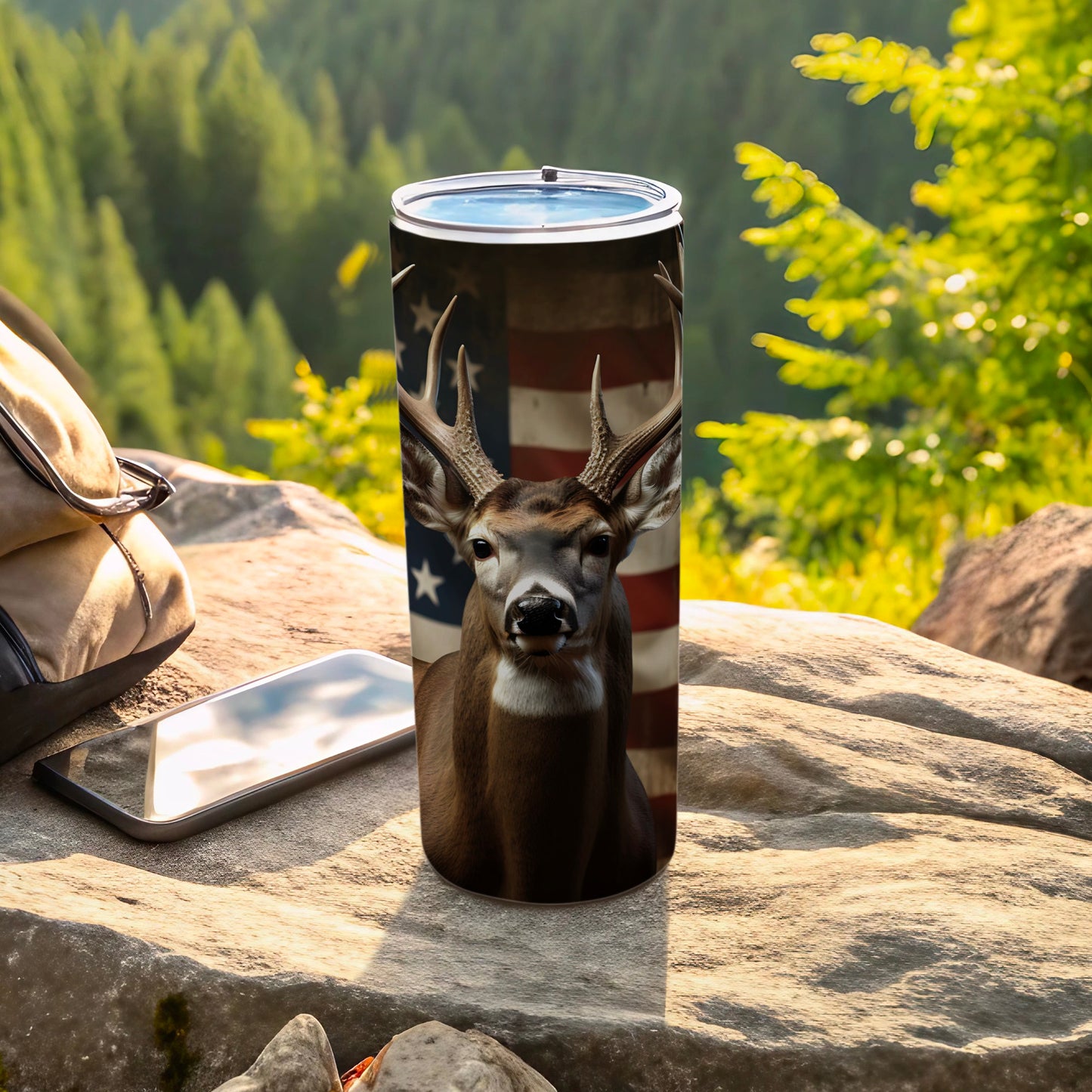 Deer head with American flag pattern on a tumbler, outdoors.