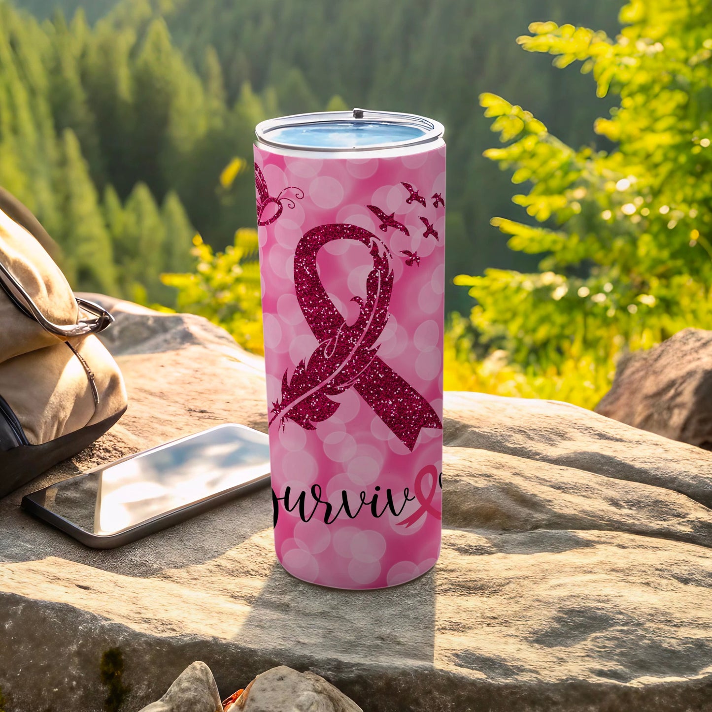 Pink glittery ribbon tumbler with "Surviviv" text and birds.