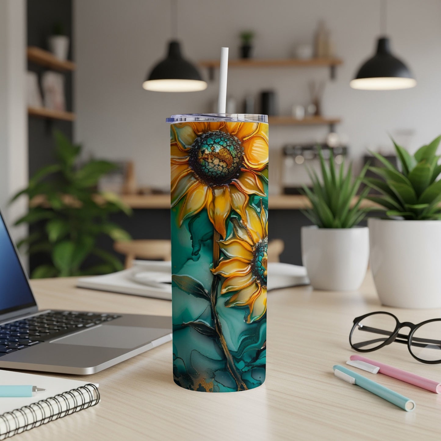 Tall tumbler with a vibrant sunflower design on a teal and gold background.